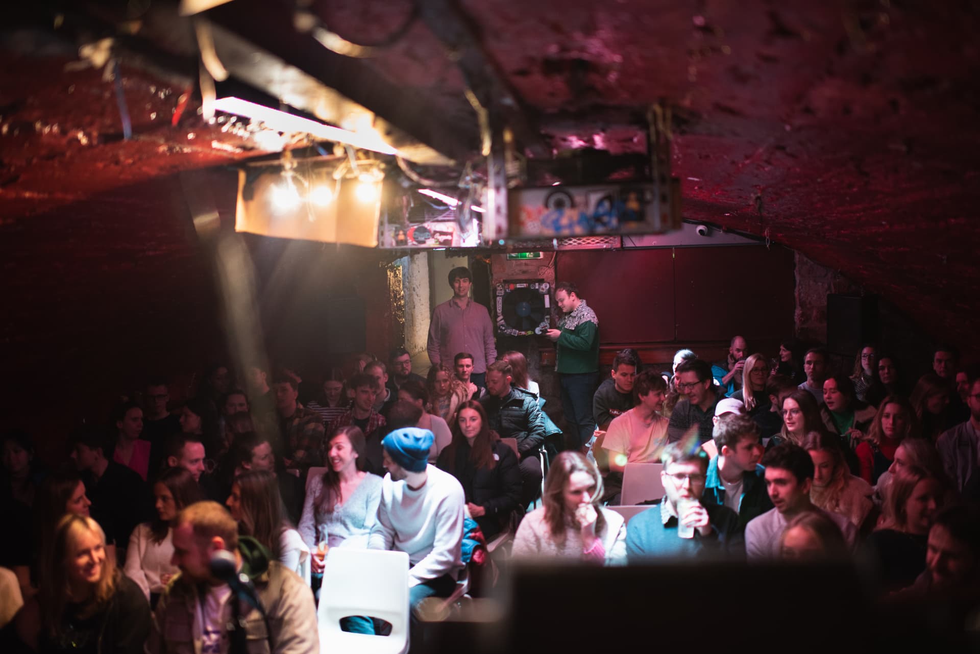 Audience packed into a basement comedy room in Bristol